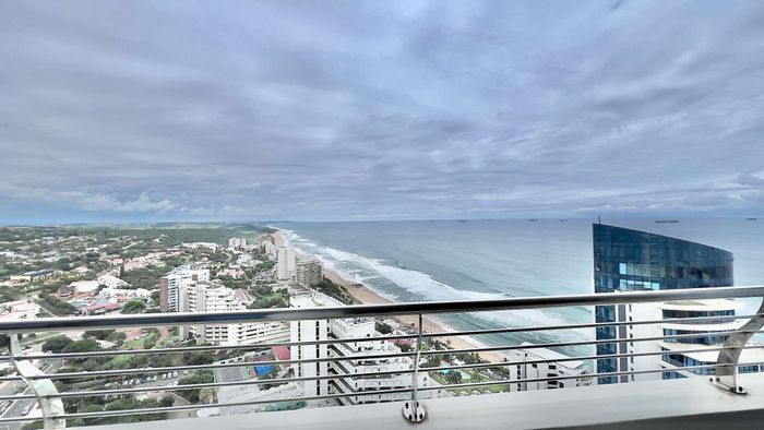 Beachfront apartment in Umhlanga Rocks Central with security, pool, and amenities. To Rent.