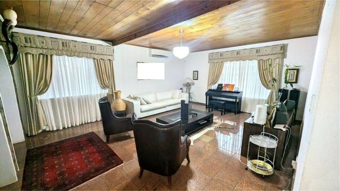For Sale: Olympia house with 4 bedrooms, large yard, and security features.