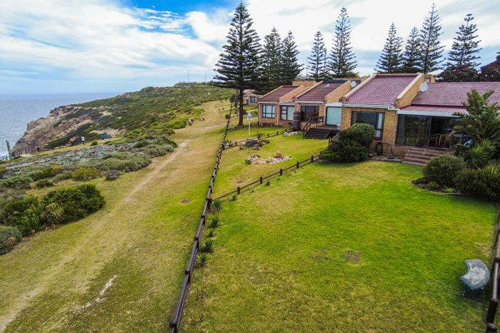 Linkside Townhouse For Sale: Coastal views, secure living, hiking trails, and garden space.