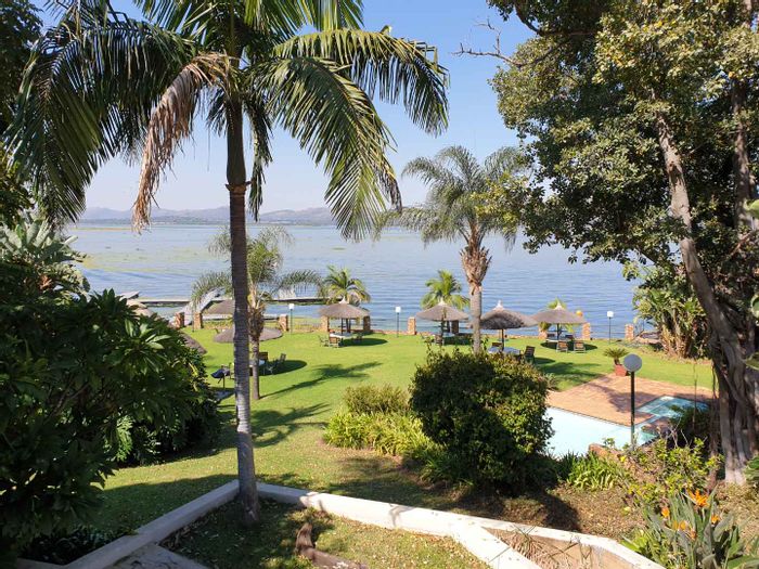 Stunning Kosmos House for Sale: Lake Views, Multi-Level, Pool, Tennis Courts & Boat Garage