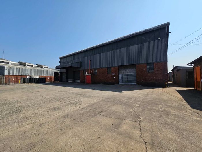 Industrial warehouse to rent in Isando with office, secure park, and yard.