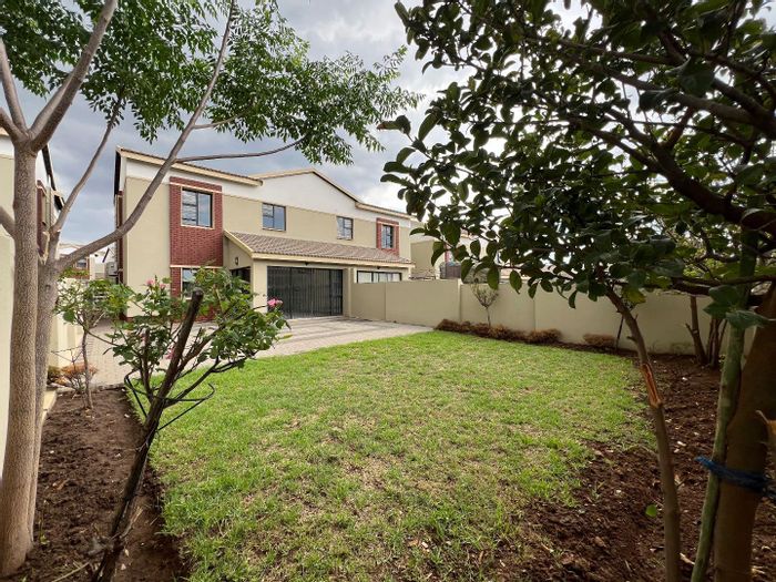 For Sale: Equestria Townhouse with 3 bedrooms, garden, double garage, and security features.