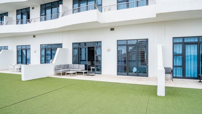 2-Bedroom Apartment To Rent in Umhlanga Rocks Central with pool, patio, and security.