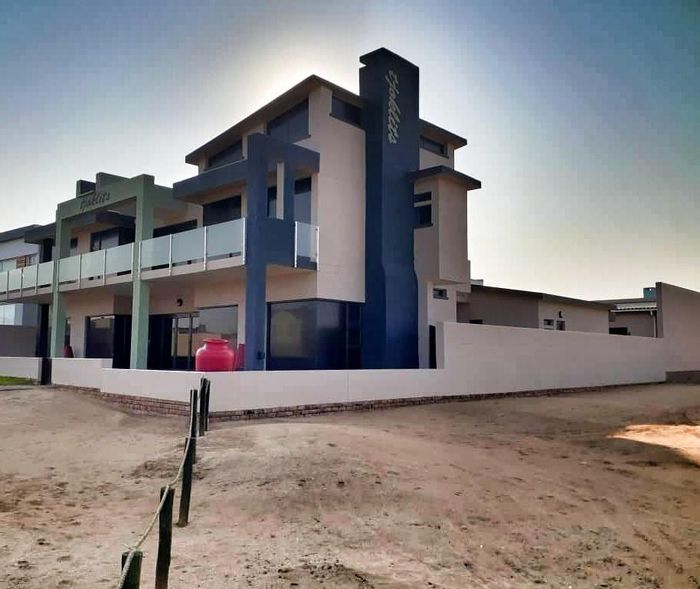 For Sale: Spacious House in Henties Bay Central with BBQ, balconies, and garages.