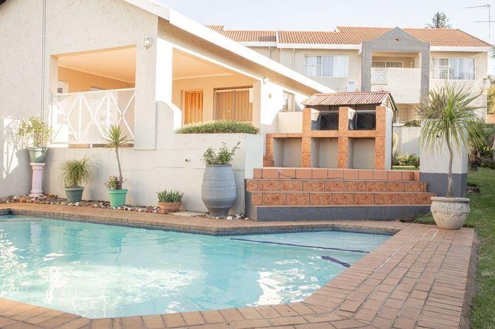 For Sale: Apartment in Constantia Kloof with private garden and secure garage.