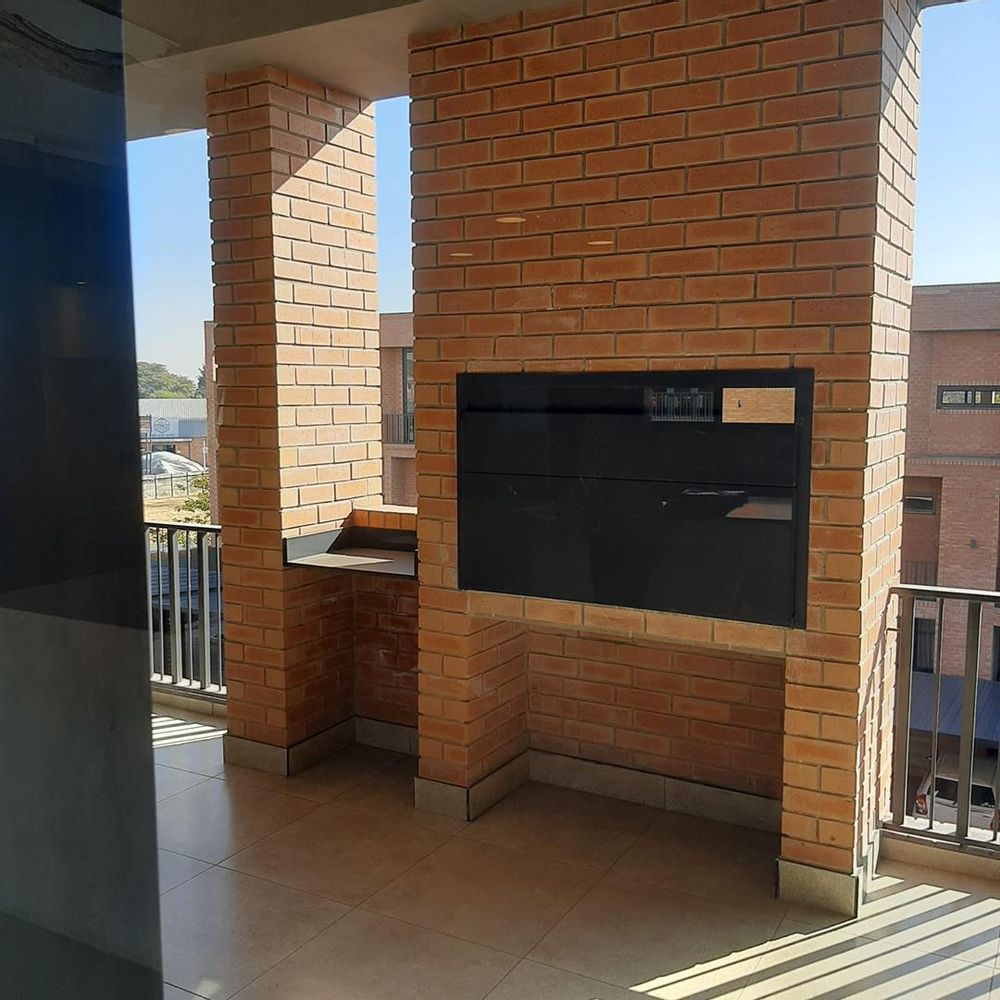 Large built in braai on covered patio