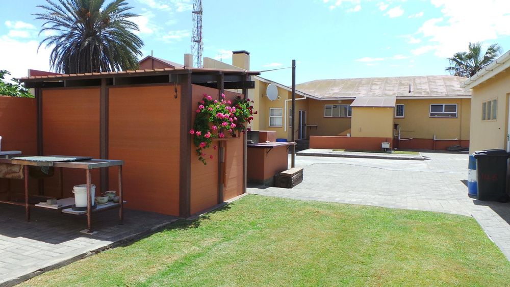 Paved backyard and fruit trees plus outside BBQ