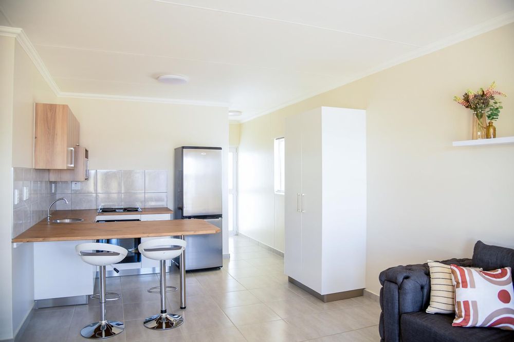 Modern kitchen with plenty of cupboards and separate, kitchen scullery.
