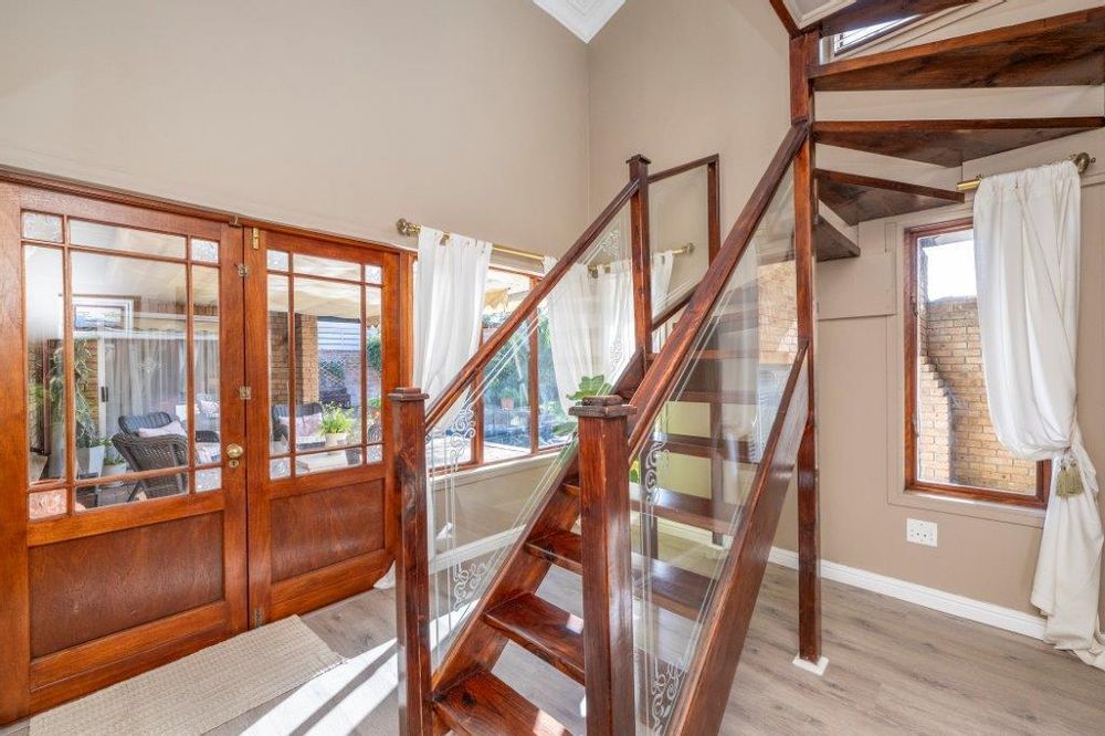 French doors to covered patio and stairway to First floor.