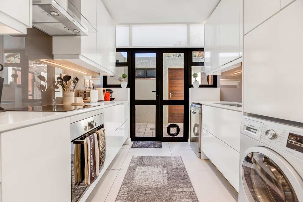 Kitchen with glass door to store room