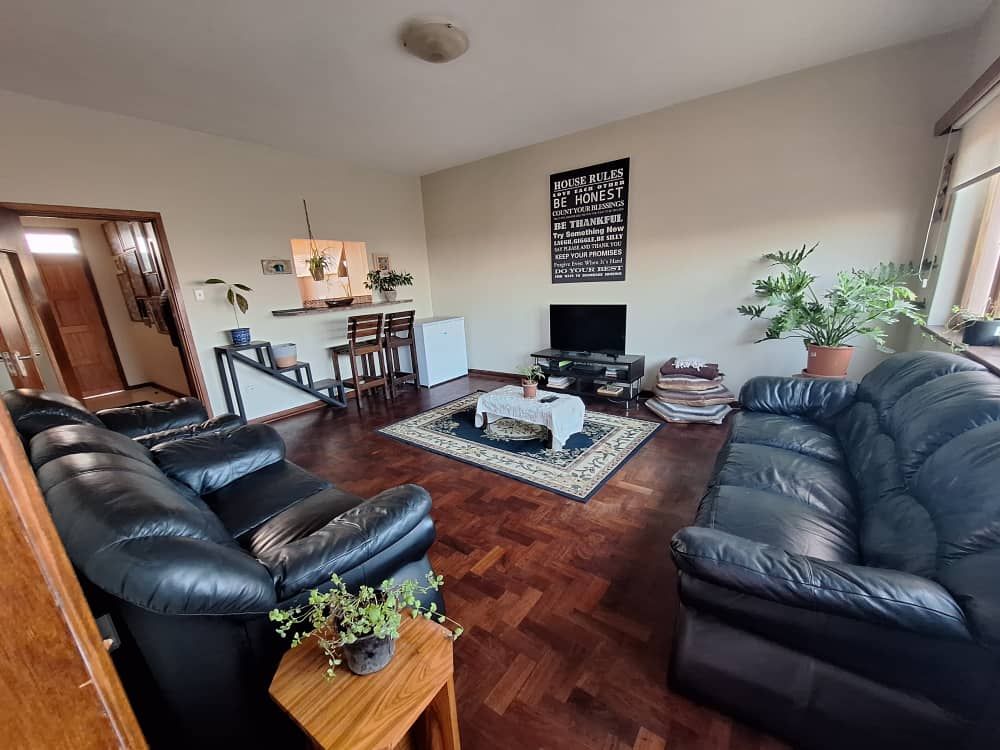 Spacious dining room - tv area with wood floors