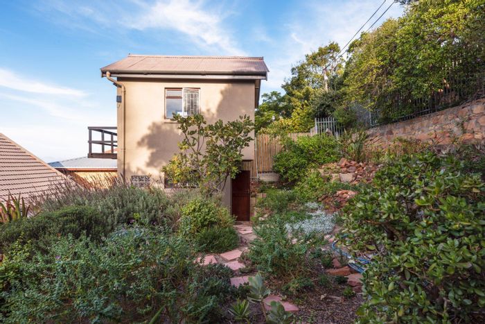 Fish Hoek Central Apartment To Rent: Duplex with kitchenette, balcony, and garden terrace.