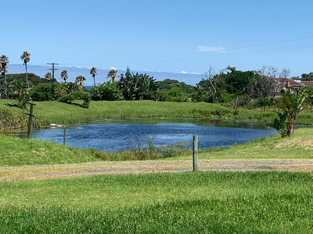 
View to the right of the small estate dam and Queensberry Bay in the distance