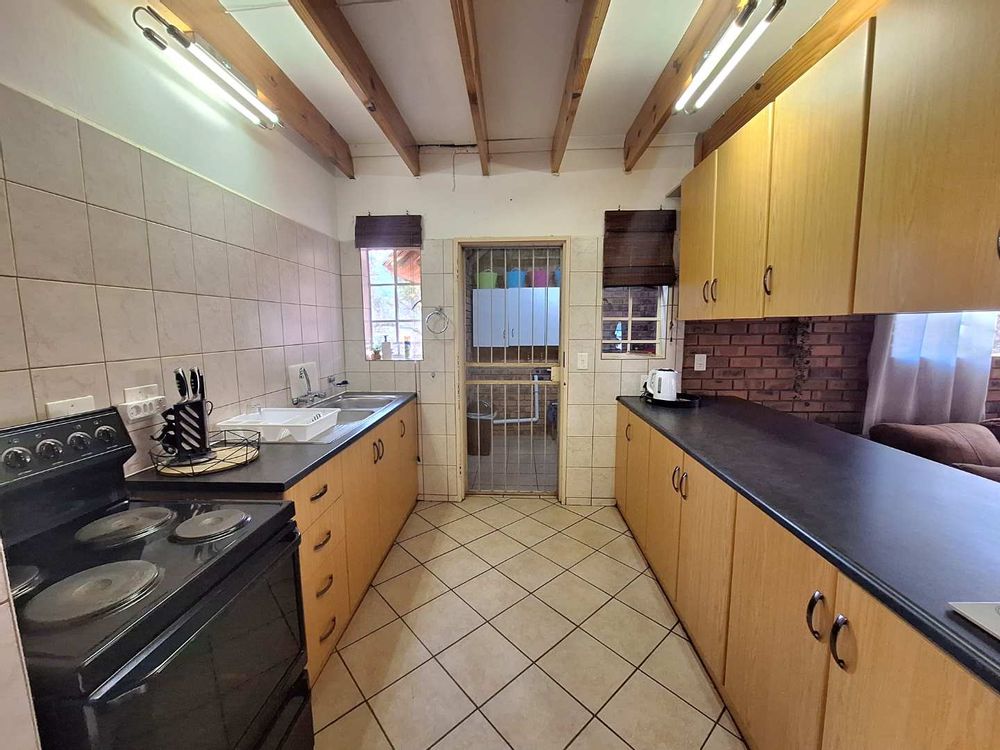 Semi open plan kitchen with scullery