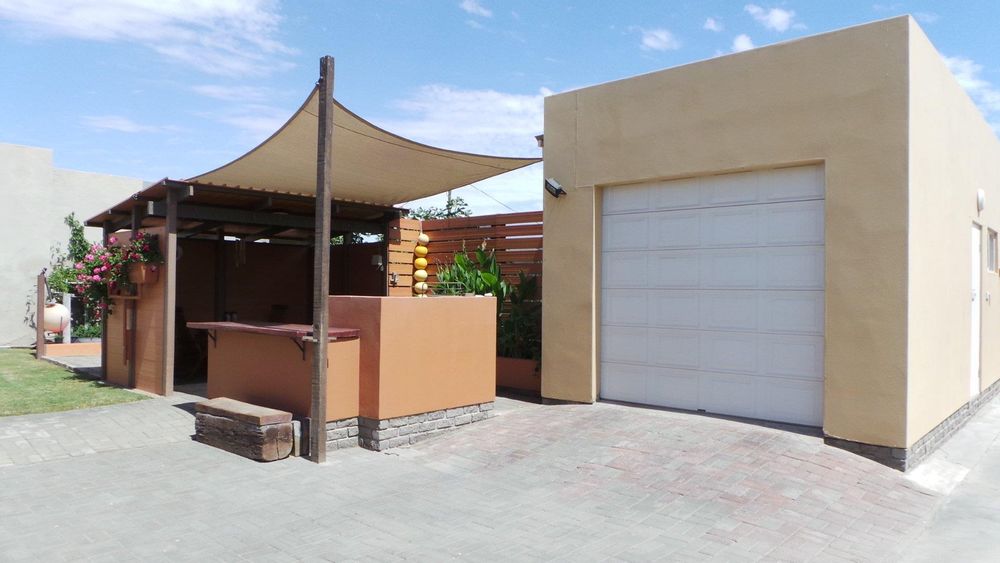 Outside entertainment area and tandem garage