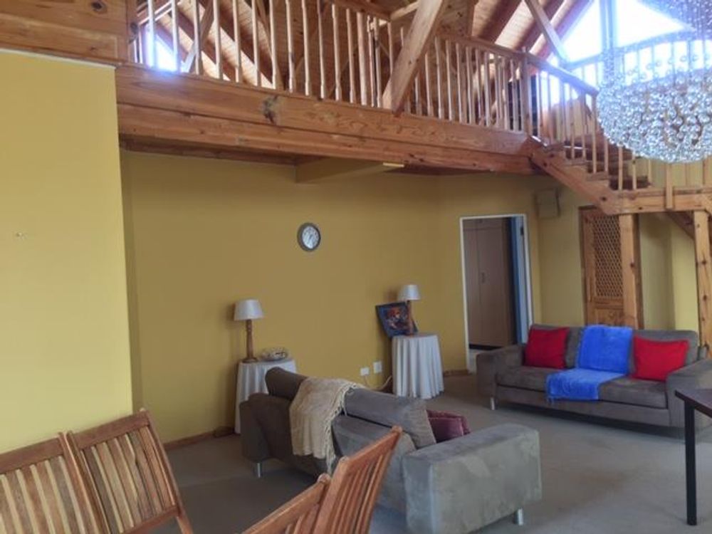 FIRST FLOOR DINING/ LOUNGE AREA & VIEW OF WOODEN LOFT