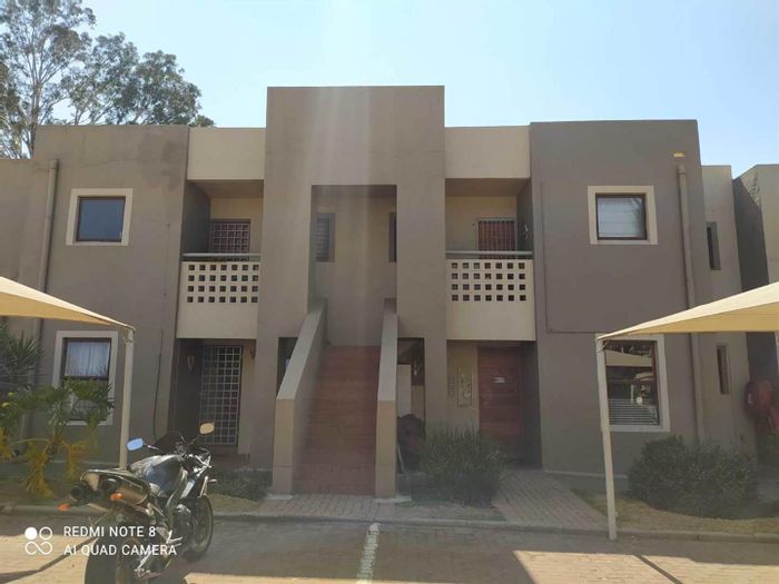 For Sale: Townhouse in New Market Park with pool, tennis court, and security.