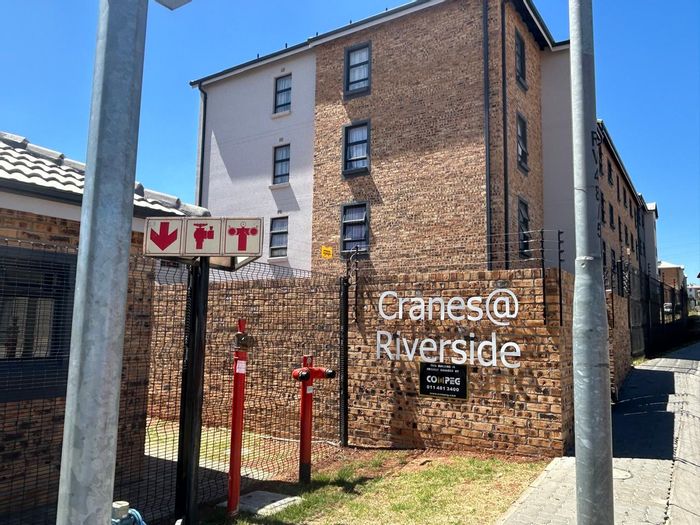 For Sale: Riverside View Apartment with 2 Bedrooms, Balcony, and Carport.