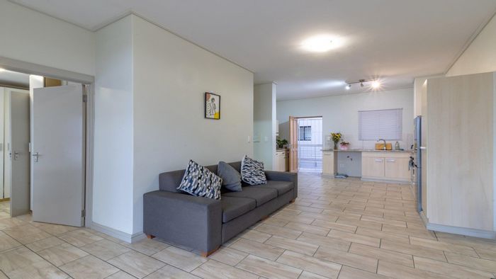 For Sale: Apartment in Milnerton Central with open plan living, balcony, and en-suite.