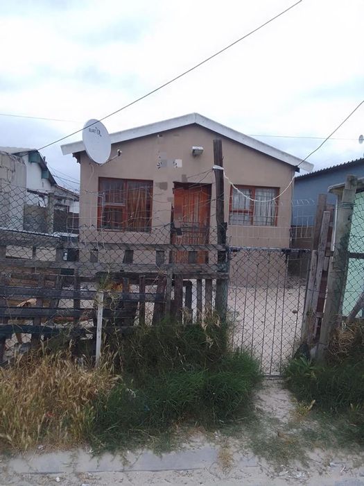 Two-bedroom house for sale in Mfuleni with secured yard and expansion potential.