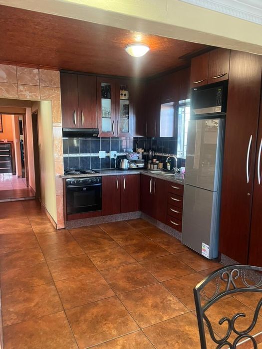 For Sale: House in Otjomuise Ext 4 with 3 bedrooms, double carport, and braai area.