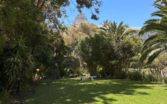 Sea Point Apartment To Rent: Secure living, leafy views, steps from the beach.
