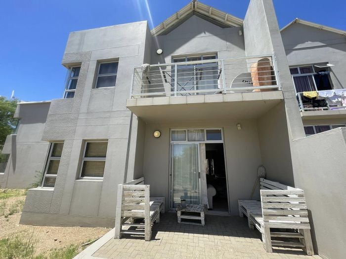 For Sale: Elisenheim Apartment with 2 Bedrooms, Garage, and Playground View.