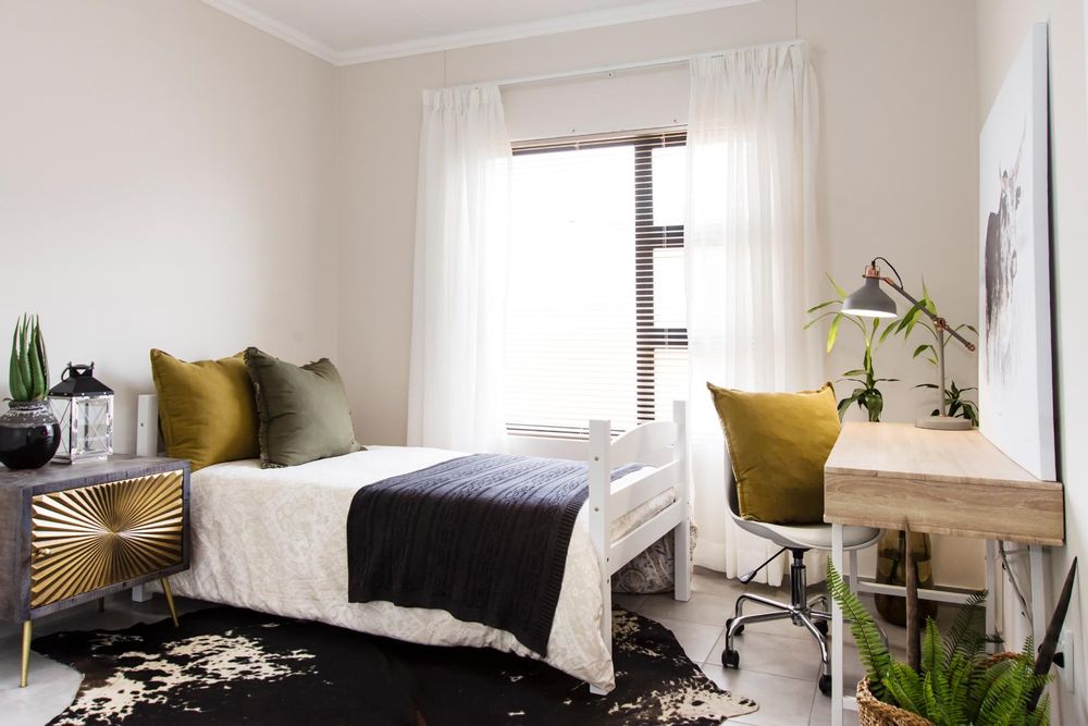 Third bedroom with built-in cupboards.