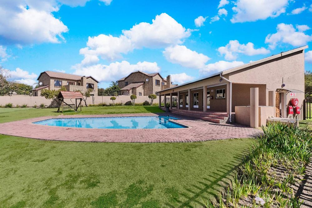 Clubhouse and pool in the complex