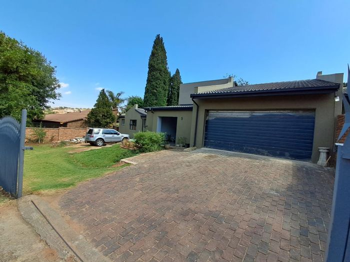 For Sale: Oakdene House with spacious garden, double garages, and solar geyser.