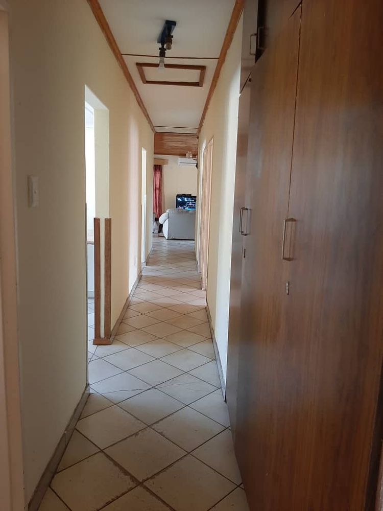 Hallway with BIC towards the living room from the bedrooms.