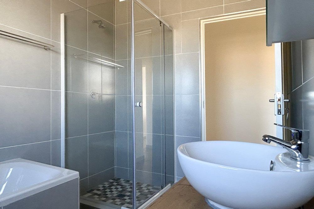 Family bathroom equipped with both shower and bath.