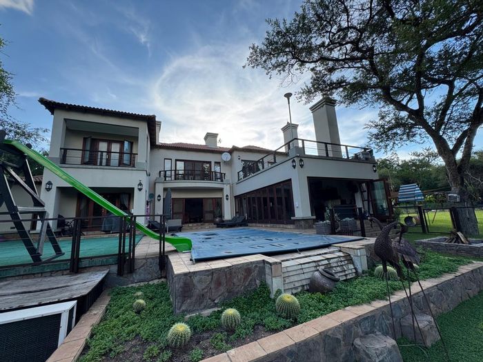 House for Sale in Burgersfort Central: Pool, wildlife estate, solar power, spacious living.