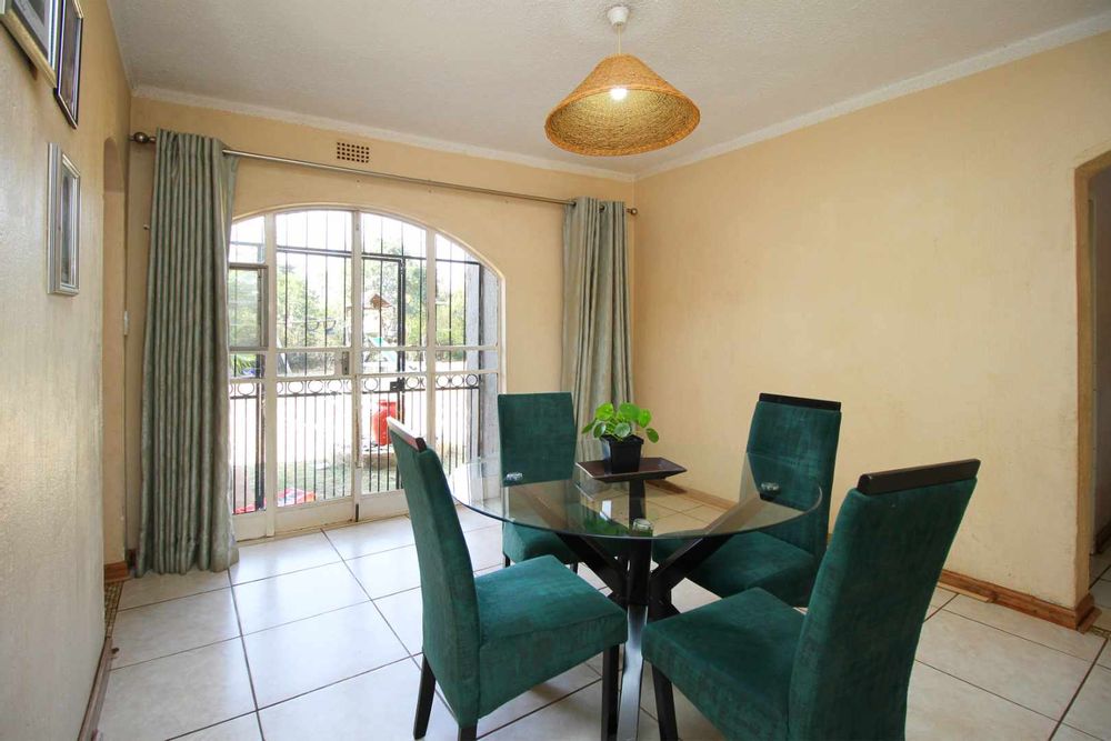 These glass doors in the Dining Room creates a seamless flow between indoor and outdoor spaces.  Opening up the home to enhance its aesthetic appeal and sense of space. The Dining Room creates versatility to braai in the Entertainment Area at the poolside and to dine at the dinner table with your family.  