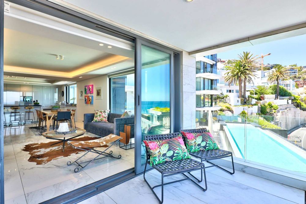 spacious luxurious open plan living space opens onto terrace