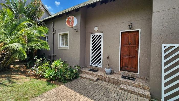 Bassonia Rock Townhouse For Sale: Two bedrooms, ensuites, open-plan living, private patio.