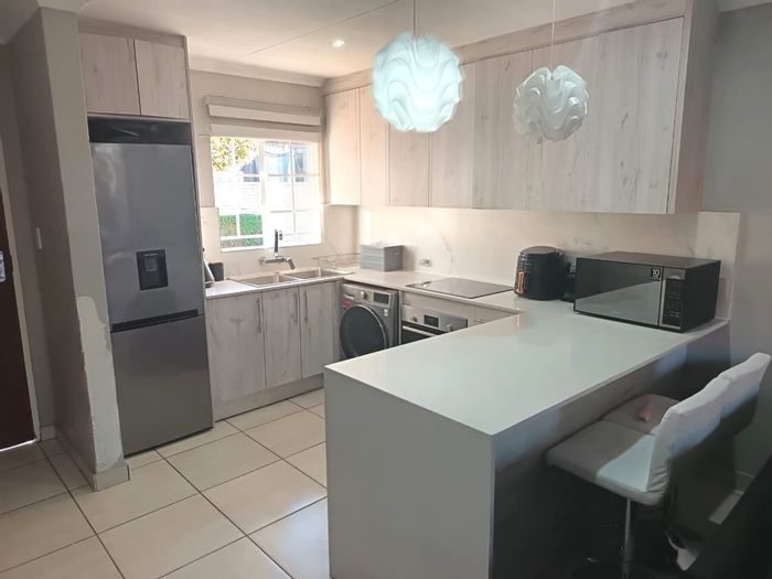 For Sale: Townhouse in The Reeds with pool, security, and private garden.