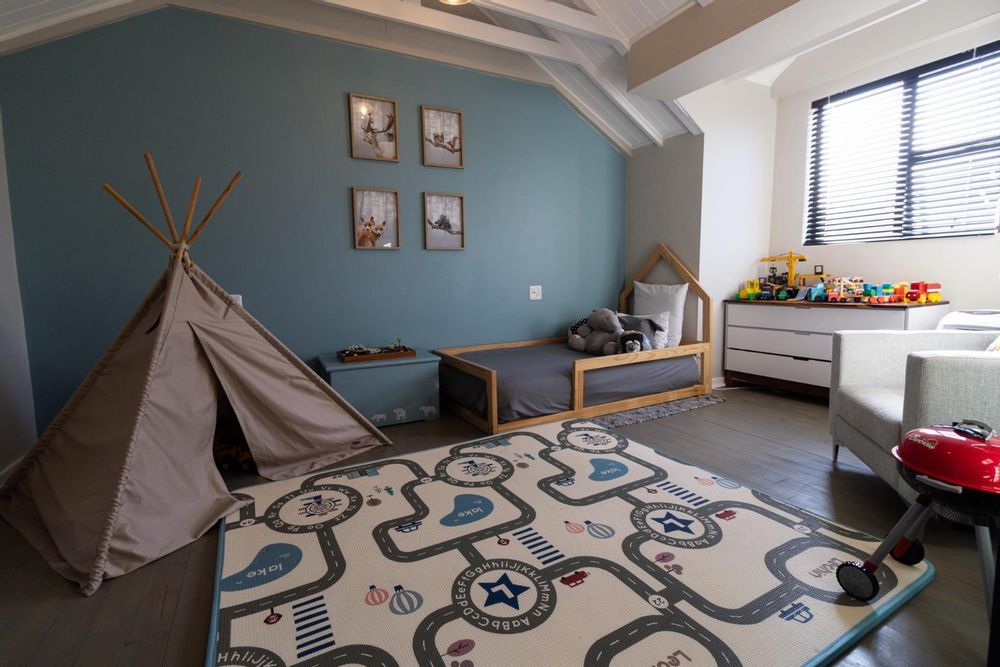 3rd Bedroom with exposed trusses and wooden floor