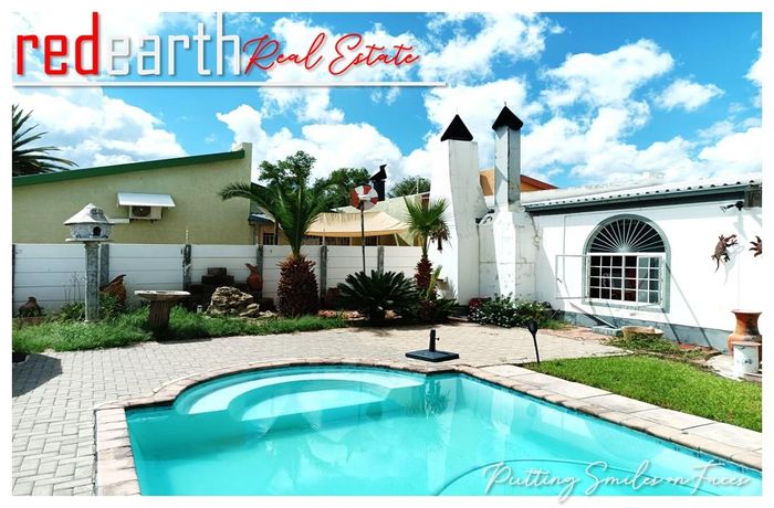 House To Rent in Cimbebasia: 2 beds, pool, patio, garage, and carports.