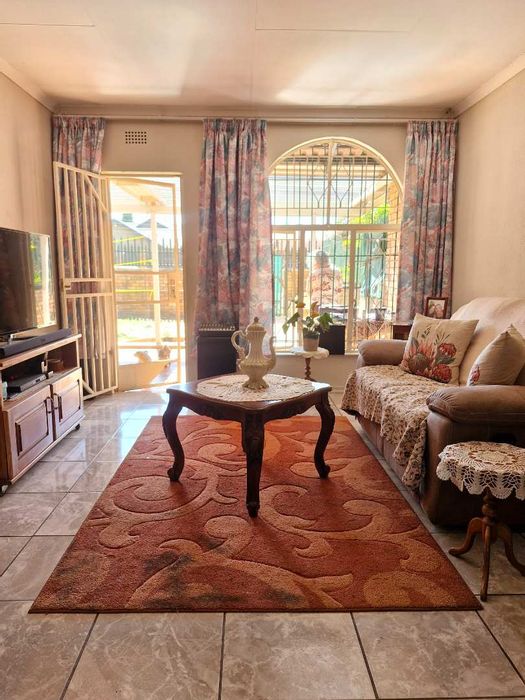 For Sale: Beyerspark Townhouse with private garden, braai area, and garage.
