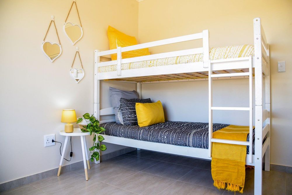 Second bedroom with built-in cupboards.