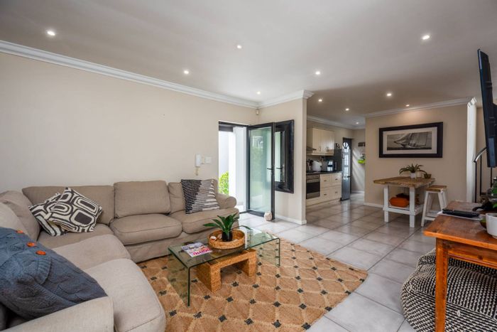 For Sale: House in Kommetjie Central with garden, double garage, and beach access.