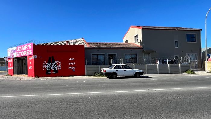 For Sale: House in Malibu Village with rental income, retail space, and security features.