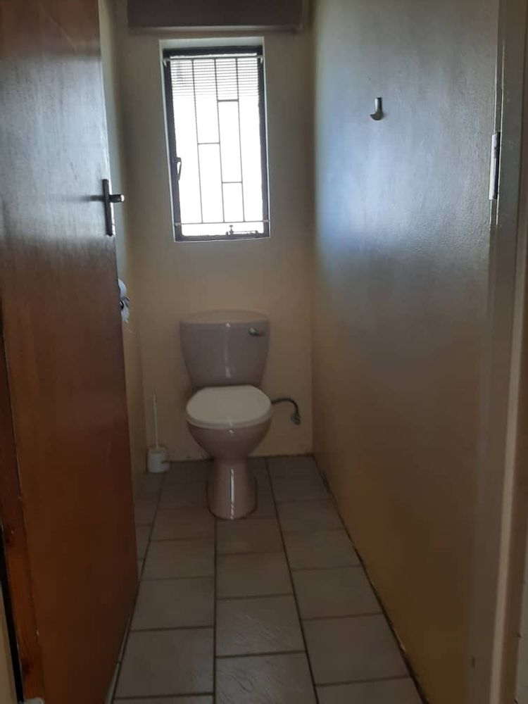 Toilet in the hallway.