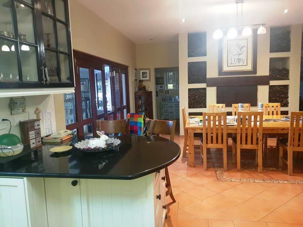 Open plan kitchen - dining room with indoor BBQ