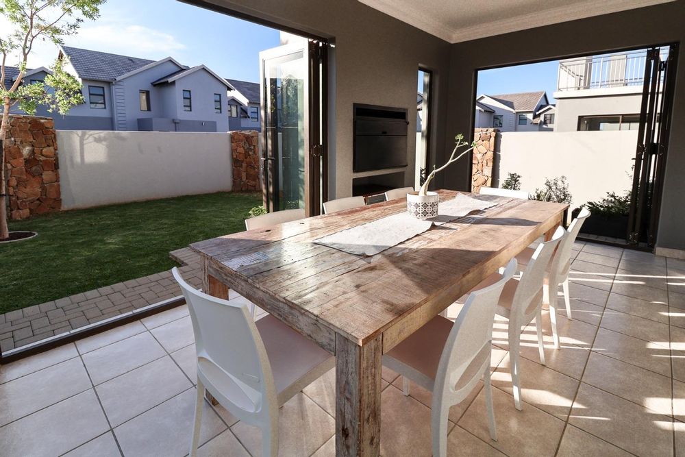 Enclosed patio with sliding and folding doors to garden