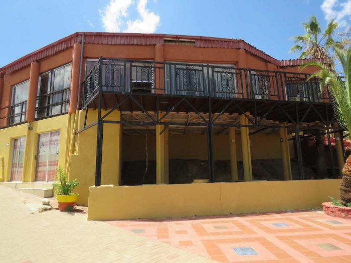 For Sale: House in Brakwater with 50+ rooms, conference facilities, and pools.