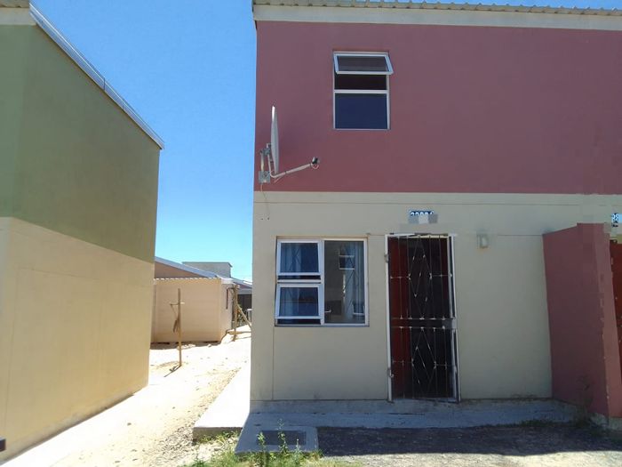 House for Sale in Mfuleni: Two bedrooms, spacious yard, close to schools.