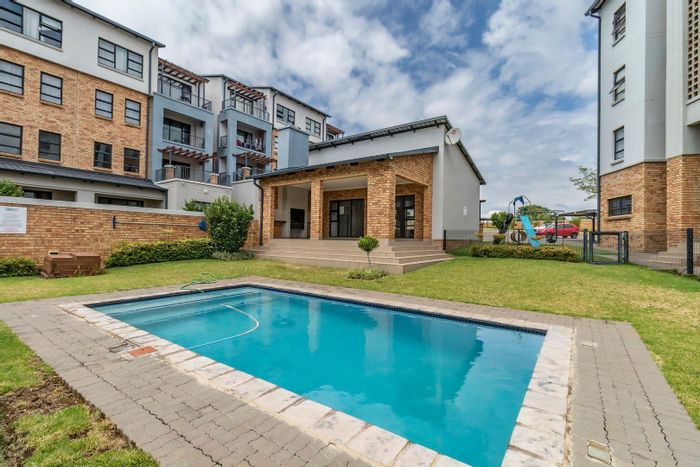 Barbeque Downs Apartment: Secure, stylish, family-friendly living with pool & race track views. Pet-friendly.