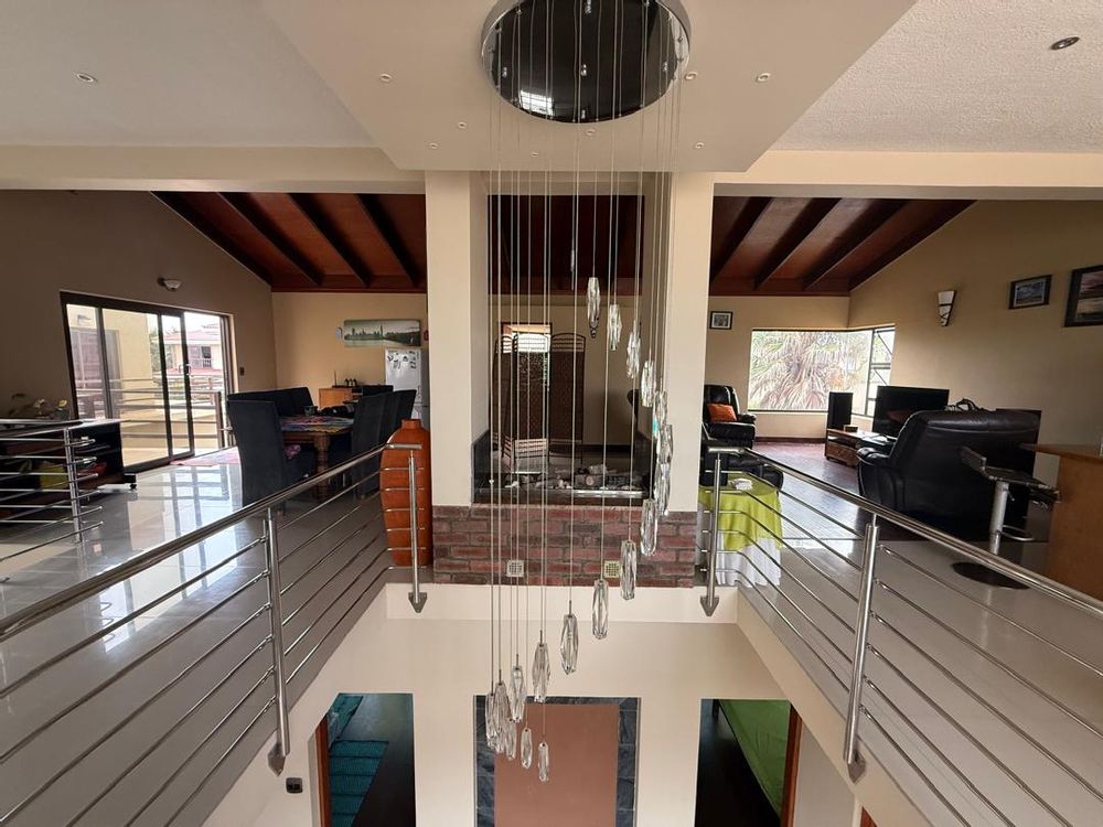 Decorative balcony viewing to the ground floor, as well as a fireplace